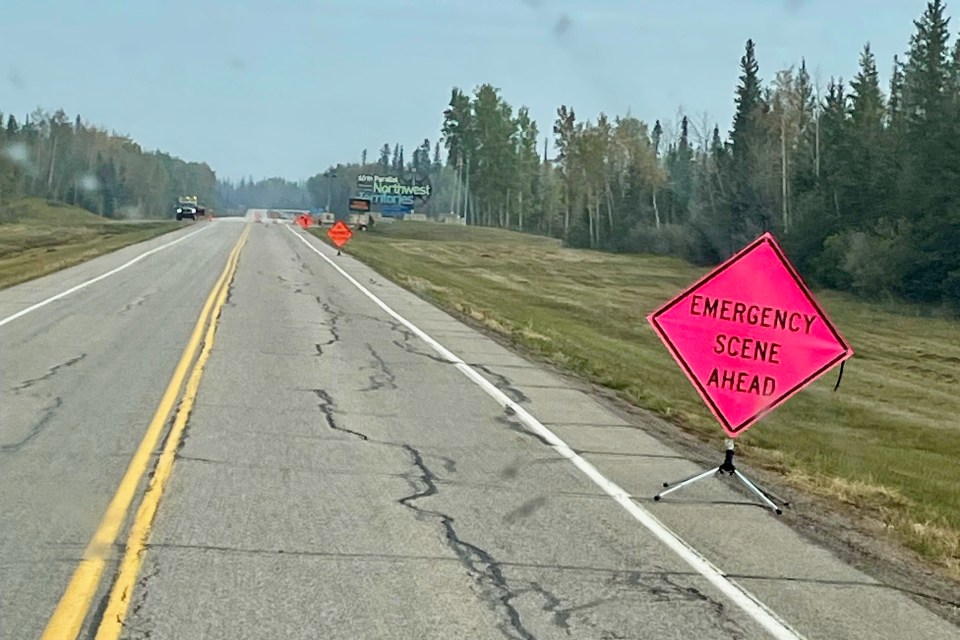 A sign at the NWT border reads "emergency scene ahead." Photo: Candace Meadus
