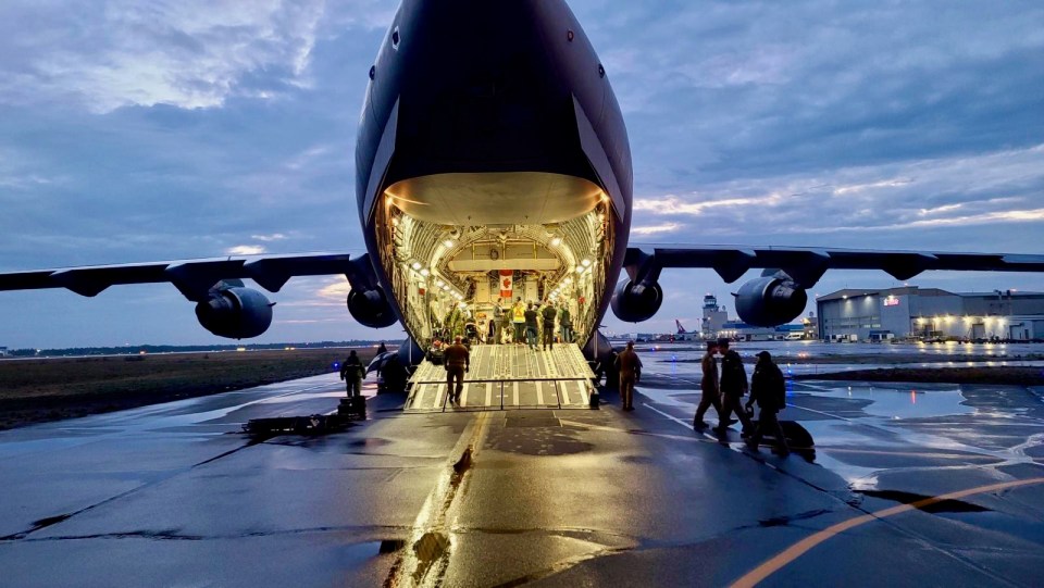 Patients are loaded into a Royal Canadian Air Force aircraft. Photo: NTHSSA