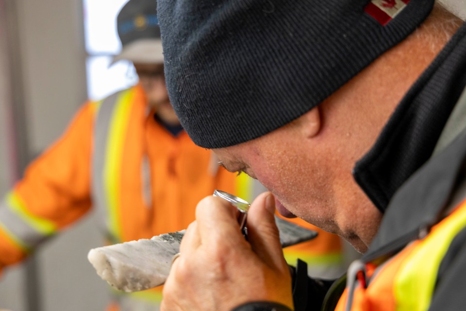 Gold Terra's Gerald Panneton inspects a core sample. Ollie Williams/Cabin Radio