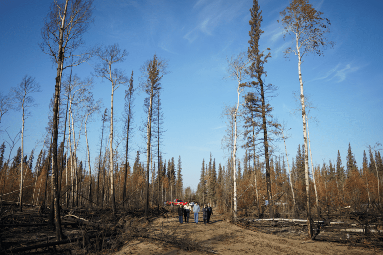 Prime Minister Justin Trudeau visits a burn area in the South Slave in October 2023. Adam Scotti/PMO