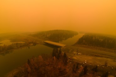 Smoke over the Yellowknife River bridge on September 23, 2023. Photo: Lucas Moore