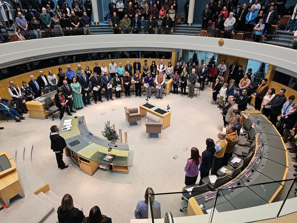 Commissioner Margaret Thom begins Friday's ceremony. Ollie Williams/Cabin Radio