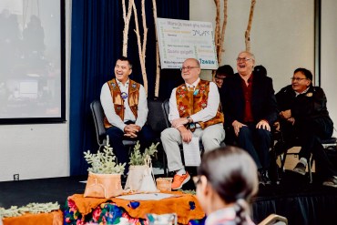 Shane Thompson, centre in trademark sneakers, at a PFP framework agreement signing in October. Photo: Jamie Stevenson