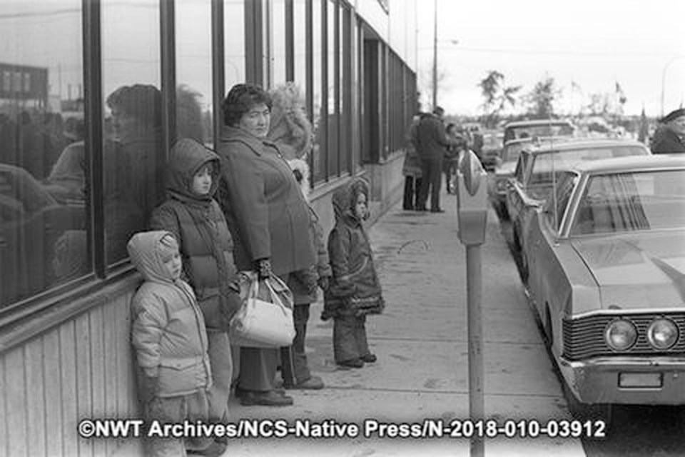 Spectators await Yellowknife's 1976 Remembrance Day parade. Tessa Macintosh/NWT Archives/Native Communications Society fonds - Native Press photograph collection/N-2018-010: 03912