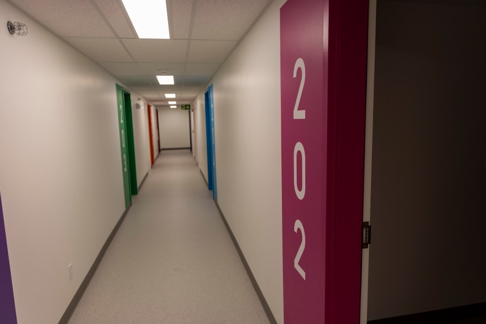 A corridor. The bright colours are designed to be child-friendly, staff said. Ollie Williams/Cabin Radio