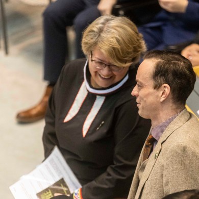 Nunakput MLA Lucy Kuptana talks to Range Lake MLA Kieron Testart. Ollie Williams/Cabin Radio