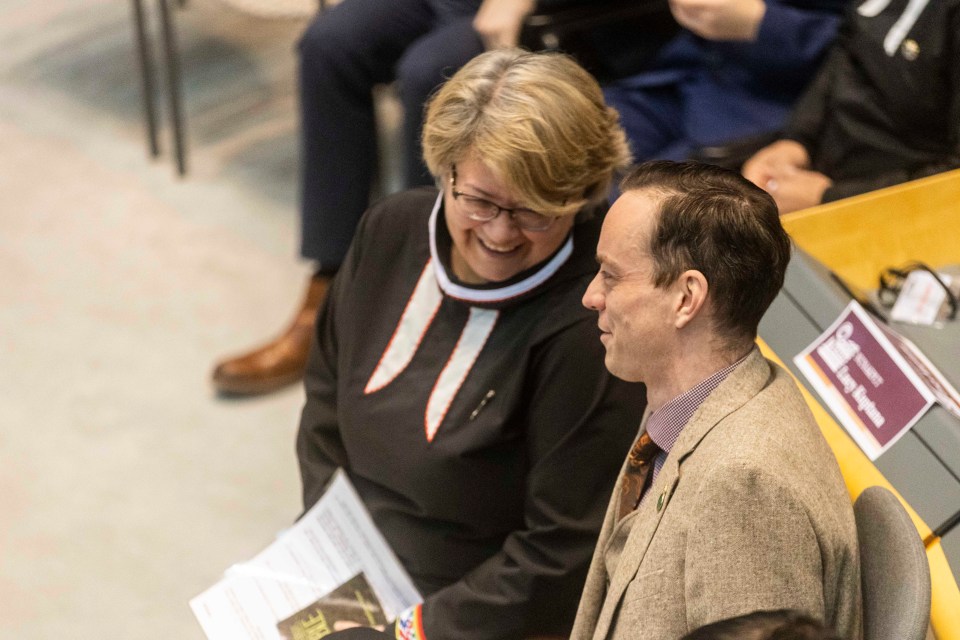 Nunakput MLA Lucy Kuptana talks to Range Lake MLA Kieron Testart. Ollie Williams/Cabin Radio