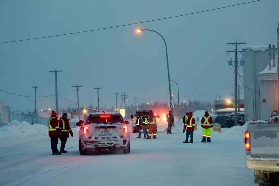 A municipal enforcement vehicle and workers gather outside the Shell facility during the fire. Ollie Williams/Cabin Radio