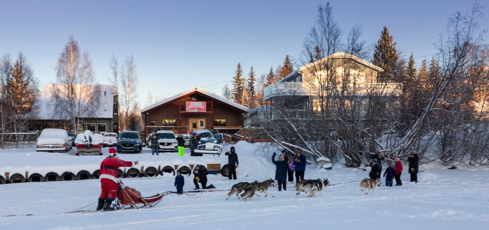 Santa and dogs pass Sundog Trading Post. Photo: Bill Braden
