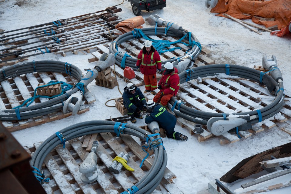 Massive cables, weighing up to six tonnes each, await installation during original construction of the bridge in 2011. Bill Braden/GNWT