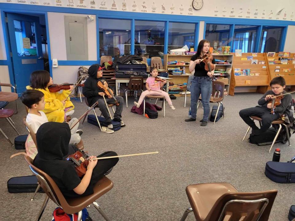Simara Wilson teaches the fiddle to northern youth. Photo: Simara Wilson