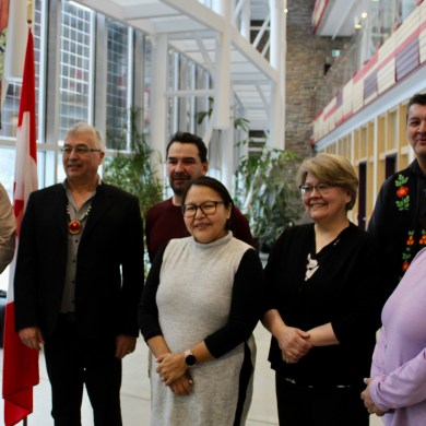 MP Michael McLeod poses with housing minister Lucy Kuptana, Tłı̨chǫ Grand Chief Jackson Lafferty and Nahanni Butte Chief Steve Vital at a housing announcement on January 18, 2024. Simons Rosenfield/Cabin Radio