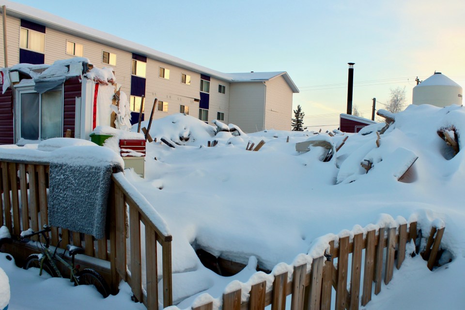 Snow lies strewn across the rubble where Garden Townhomes units once stood. Simona Rosenfield/Cabin Radio