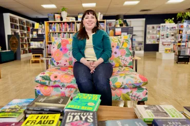 Jenn Baerg Steyn inside the Yellowknife Book Cellar. Ollie Williams/Cabin Radio