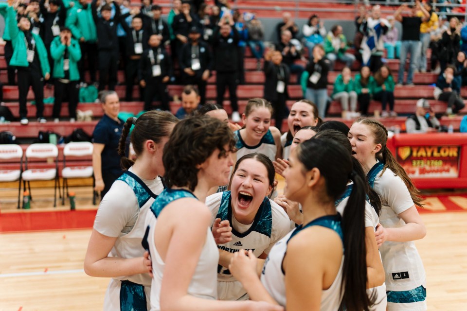 Abby Nevitt, centre, celebrates gold with teammates. Sarah Pruys/Team NT