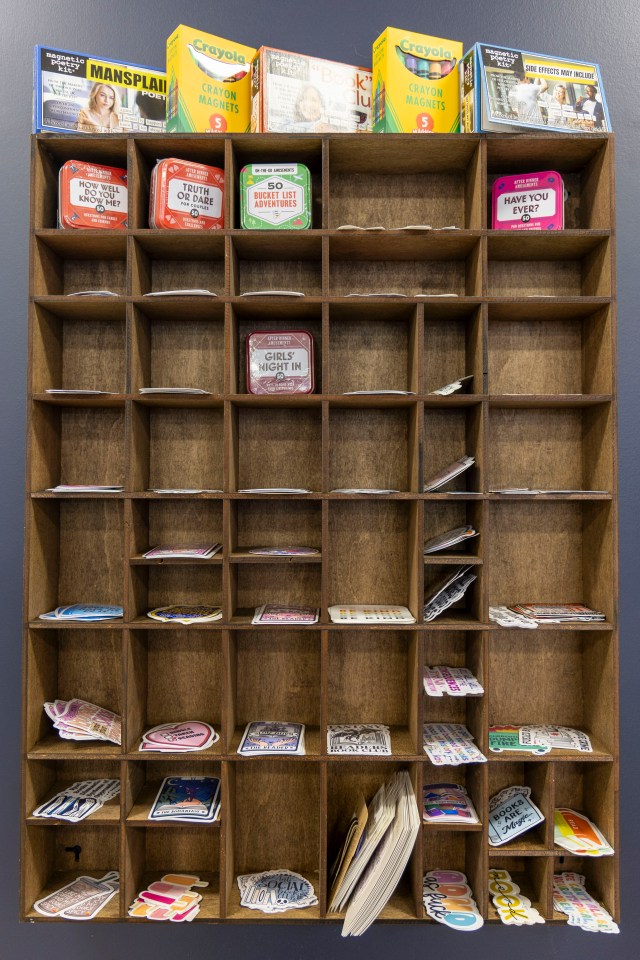 Pigeonholes of stickers and games. Ollie Williams/Cabin Radio