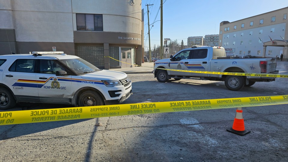 An RCMP vehicle behind police tape on April 17, 2024. Ollie Williams/Cabin Radio