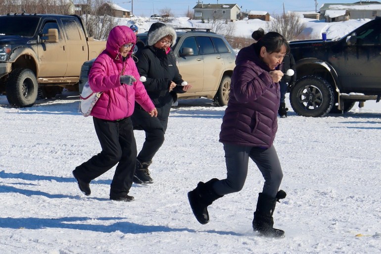 Contenders race with eggs at the 2024 Peel River Jamboree. Simona Rosenfield/Cabin Radio