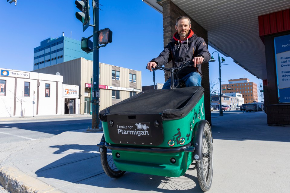 Adam Denley with his "reverse trike," featuring a cargo compartment. Ollie Williams/Cabin Radio