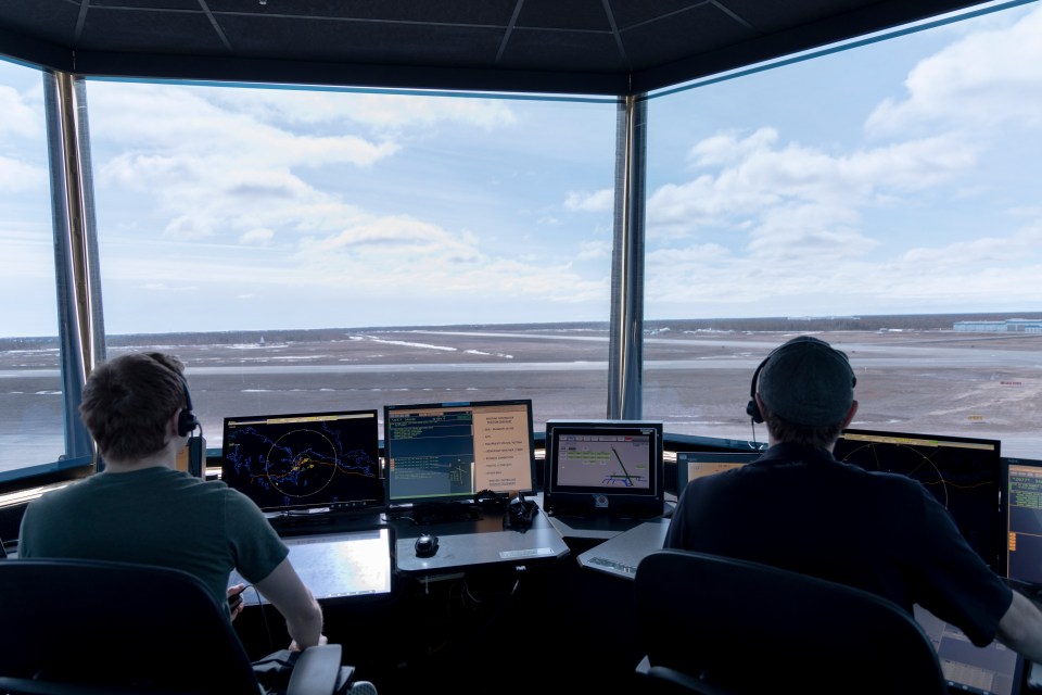 Air traffic controllers inside the Yellowknife tower. Ollie Williams/Cabin Radio