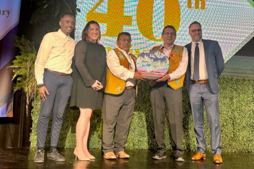 From left: Herve Manzi of Rio Tinto, Rebecca Connelly of Det’on Cho, Chief Fred Sangris, Chief Ernest Betsina and Det'on Cho's Mark Lewis receive the award. Photo supplied by Det'on Cho