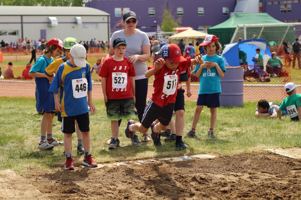 Children compete in standing long jump at the 2018 NWT Track and Field Championships in Hay River. Sarah Pruys/South Slave Divisional Education Council