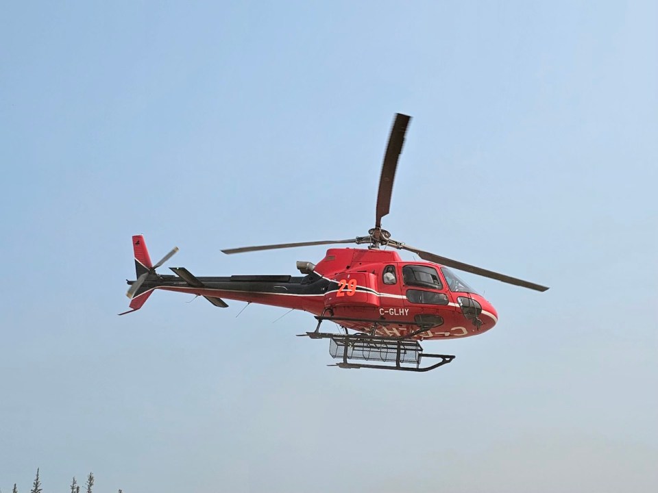 An NWT Fire photo of a helicopter working on wildfire operations in July 2024.
