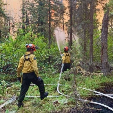 Firefighters tackling fire ZF011 are seen in a photo published by NWT Fire.