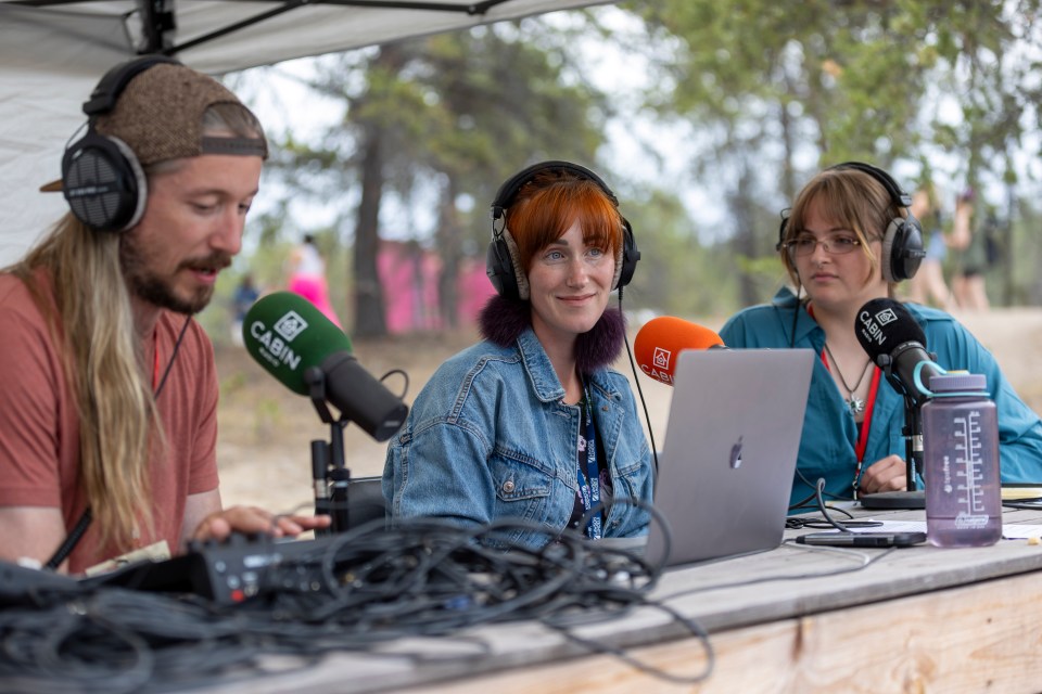 From left: Cabin Radio's Scott Letkeman, Charlotte Morritt-Jacobs and Elke Sorensen co-host Cabin Radio's live coverage of Saturday at Folk on the Rocks 2024. Ollie Williams/Cabin Radio