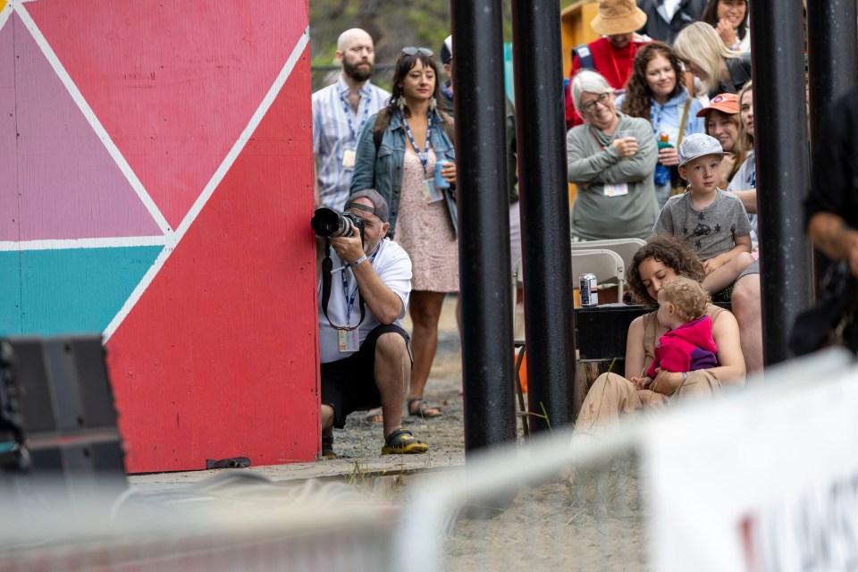 Photographer Rob Hart shoots the main stage from the VIP area. You never know where a famous actress might be hanging out. Ollie Williams/Cabin Radio