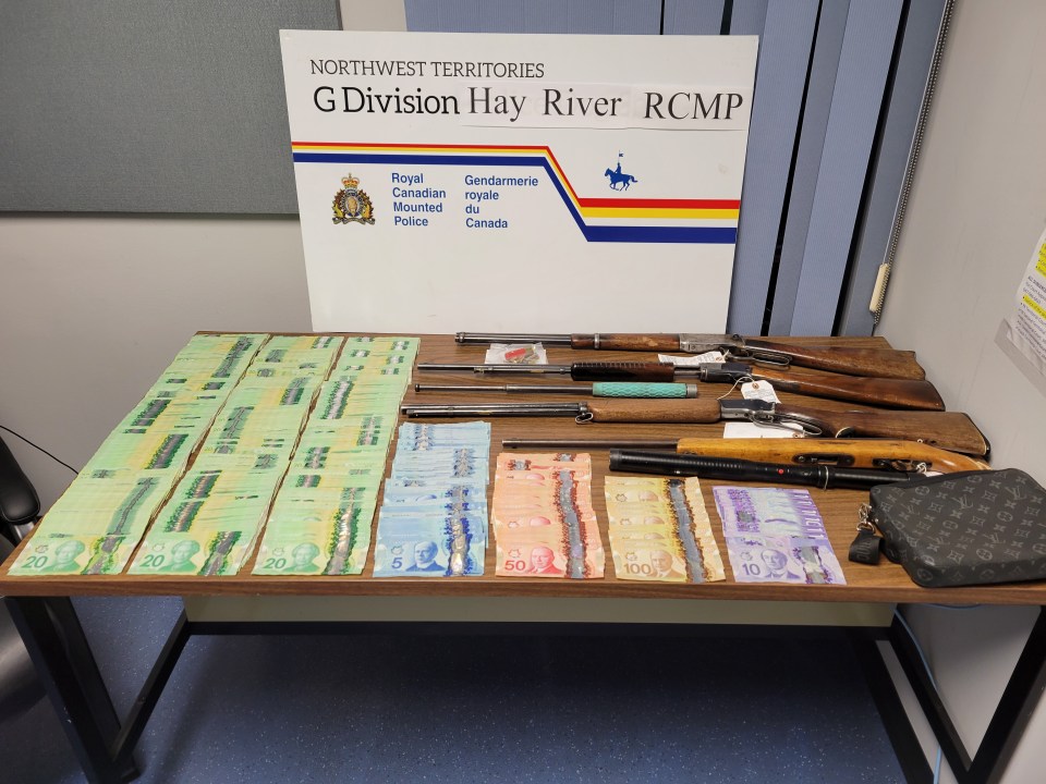 Four stolen guns and $17K seized by RCMP in Hay River