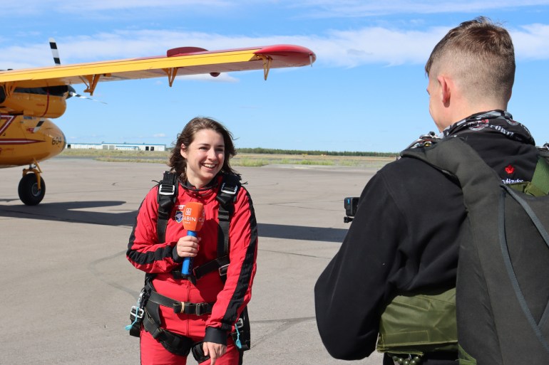 Cabin Radio intern Claire McFarlane prepares for her jump with the SkyHawks. Caelan Beard/Cabin Radio