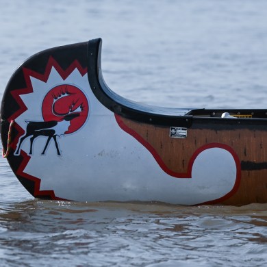 The Gwich'in Tribal Council's logo appears on a canoe in an image from the We Are United As One canoe trip published by the GTC in August 2024.