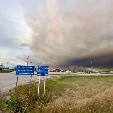 A cloud of smoke rolls in above Enterprise on August 26, 2024. Photo: Stephen Fochuk