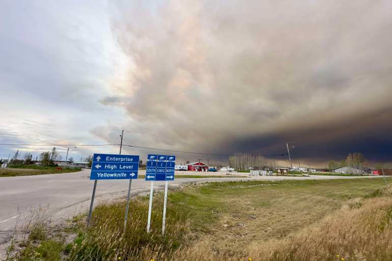A cloud of smoke rolls in above Enterprise on August 26, 2024. Photo: Stephen Fochuk
