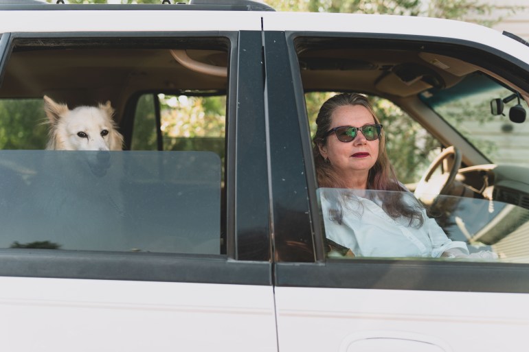 Aingeal Stone with one of her dogs in her vehicle, safely home in Yellowknife. Sarah Pruys/Cabin Radio