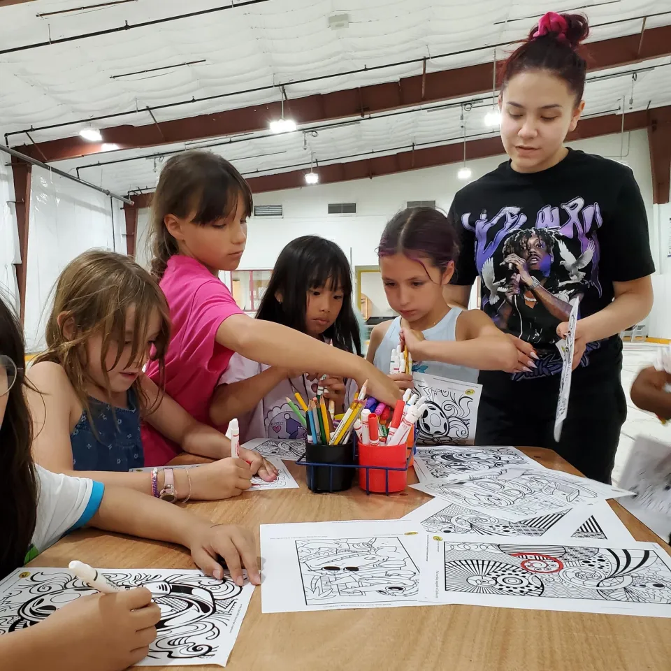 Children inside Inuvik's curling club turned cooling centre on August 8, 2024. Photo: Town of Inuvik