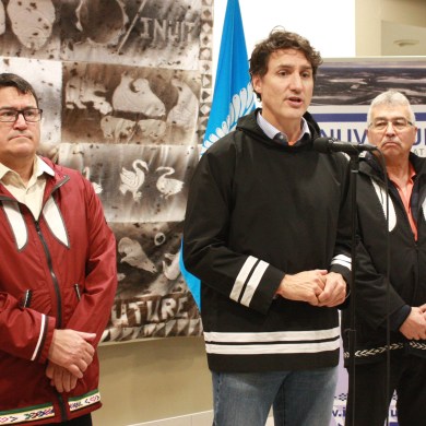 From left: IRC Chair Duane Ningaqsiq Smith, Prime Minister Justin Trudeau and NWT MP Michael McLeod in Inuvik on September 30, 2024. Emily Blake/Cabin Radio