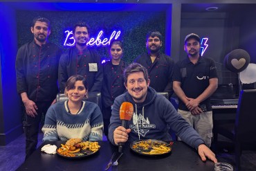 Cabin Radio's Aastha and Ollie, front from left, with the crew at Bluebell as they sample a 2024 Burger Week entry. Sarah Pruys/Cabin Radio