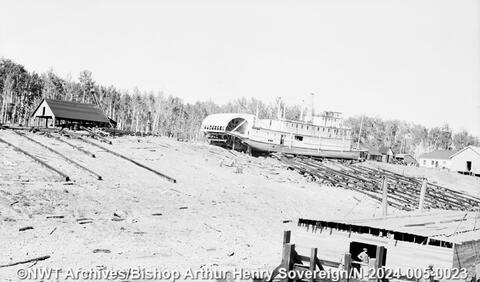 The "Mackenzie River," a steamboat ready for launching, at a shipyard in Fort Smith sometime between 1932 and 1945. Bishop Arthur Henry Sovereign/NWT Archives