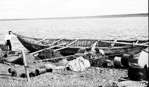 A mooseskin boat on the shore in Tulita, taken between 1932 and 1940. Bishop Arthur Henry Sovereign/NWT Archives