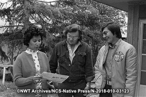 Gloria George holding "The Hub" newspaper on her northern tour. L-R: Gloria George, Charles Overvold, unidentified man