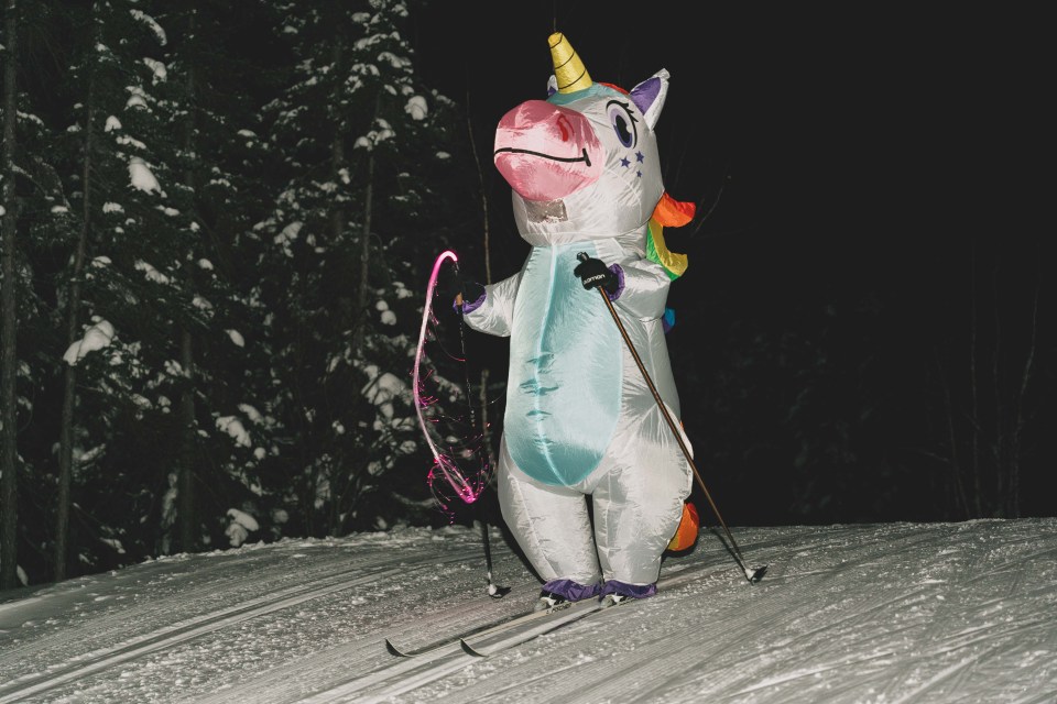 Natasha McCagg skis down a small hill with visibilty significantly reduced by her costume. Sarah Pruys/Cabin Radio