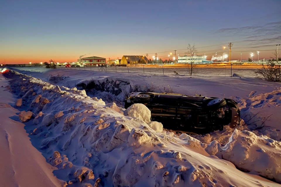 The vehicle with Yellowknife Airport buildings in the background. Ollie Williams/Cabin Radio