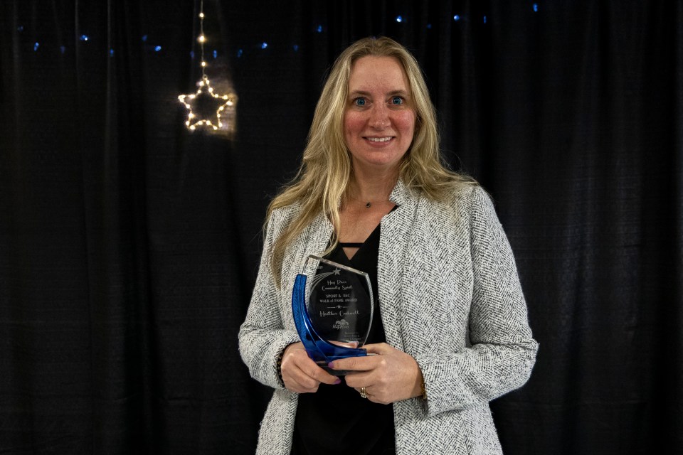 Heather Coakwell with her Hay River sport and recreation Walk of Fame award. Ollie Williams/Cabin Radio