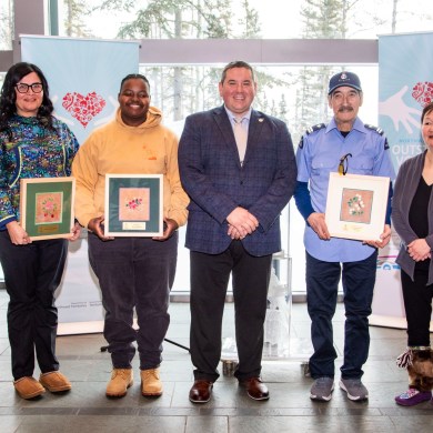 Volunteer award recipients at the NWT legislature with minister Vince McKay, centre. Photo: GNWT