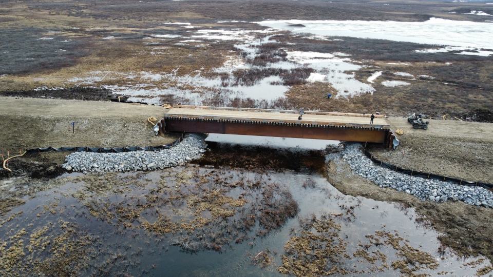 A wooden bridge under construction as part of the Inuvialuit Energy Security Project. Photo Inuvialuit Regional Corporation via CIB
