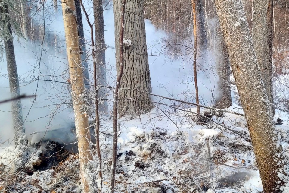 A smouldering winter wildfire in the NWT. Photo: GNWT
