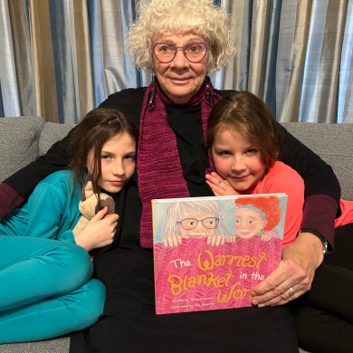 Tamara Levine, centre in a submitted photo, shares The Warmest Blanket in the World with her grandchildren.