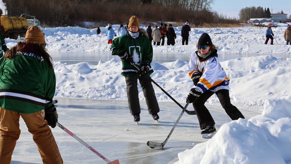 Players compete in the 2025 Polar Pond Hockey tournament in Hay River. Claire McFarlane/Cabin Radio